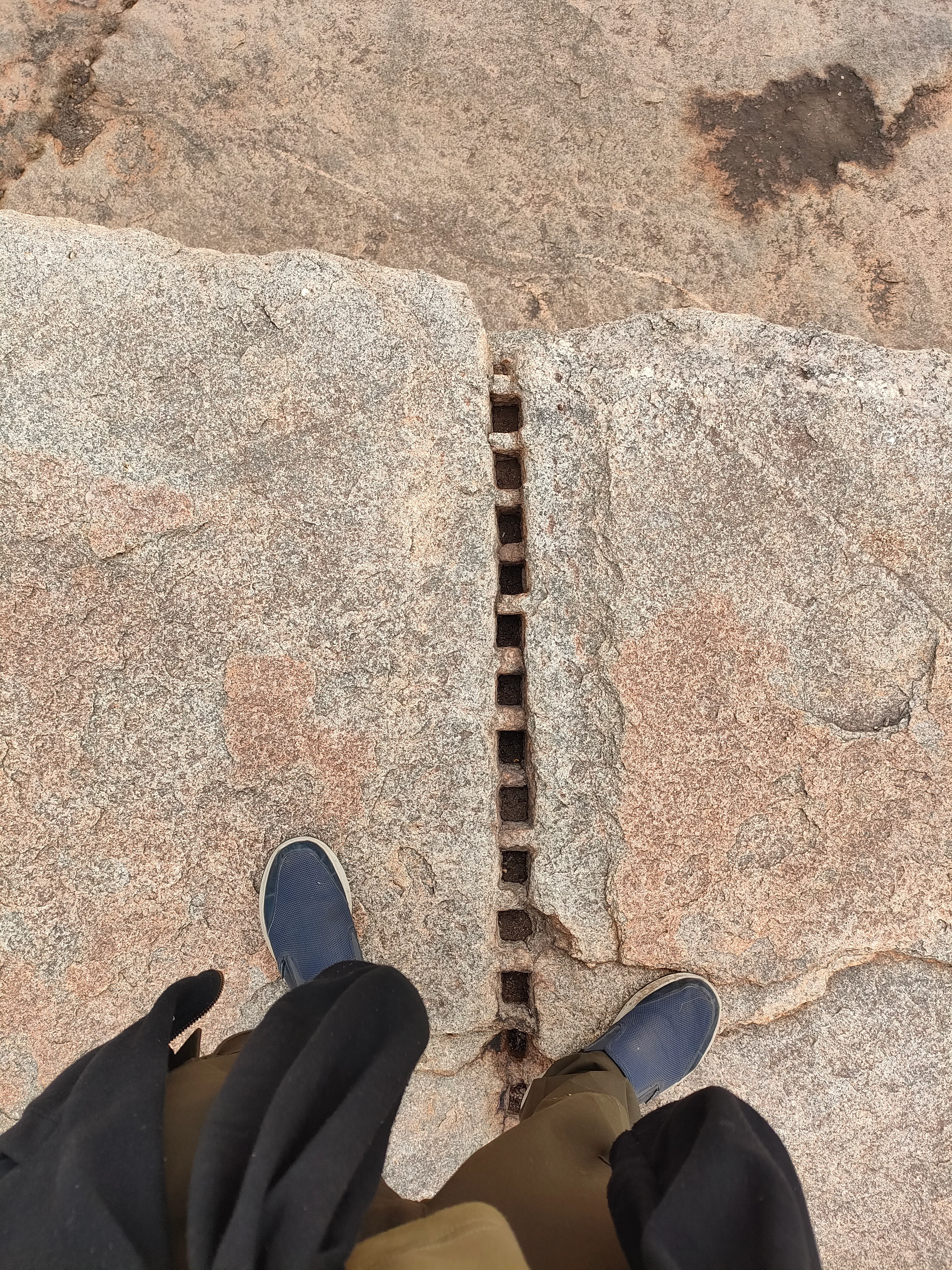 On a hampi rock near the octagon bath